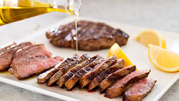You should put olive oil on steak before grilling