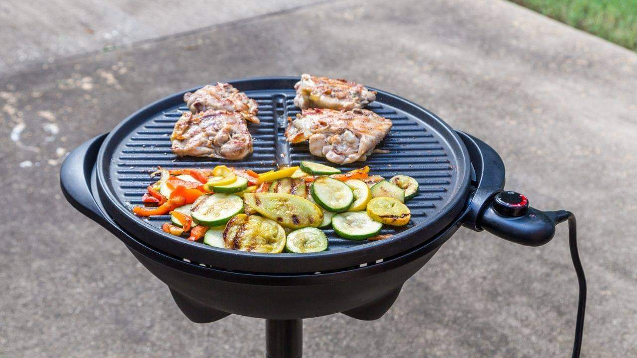 Using charcoal or wood chips is the best way to get a charcoal flavor on an electric grill