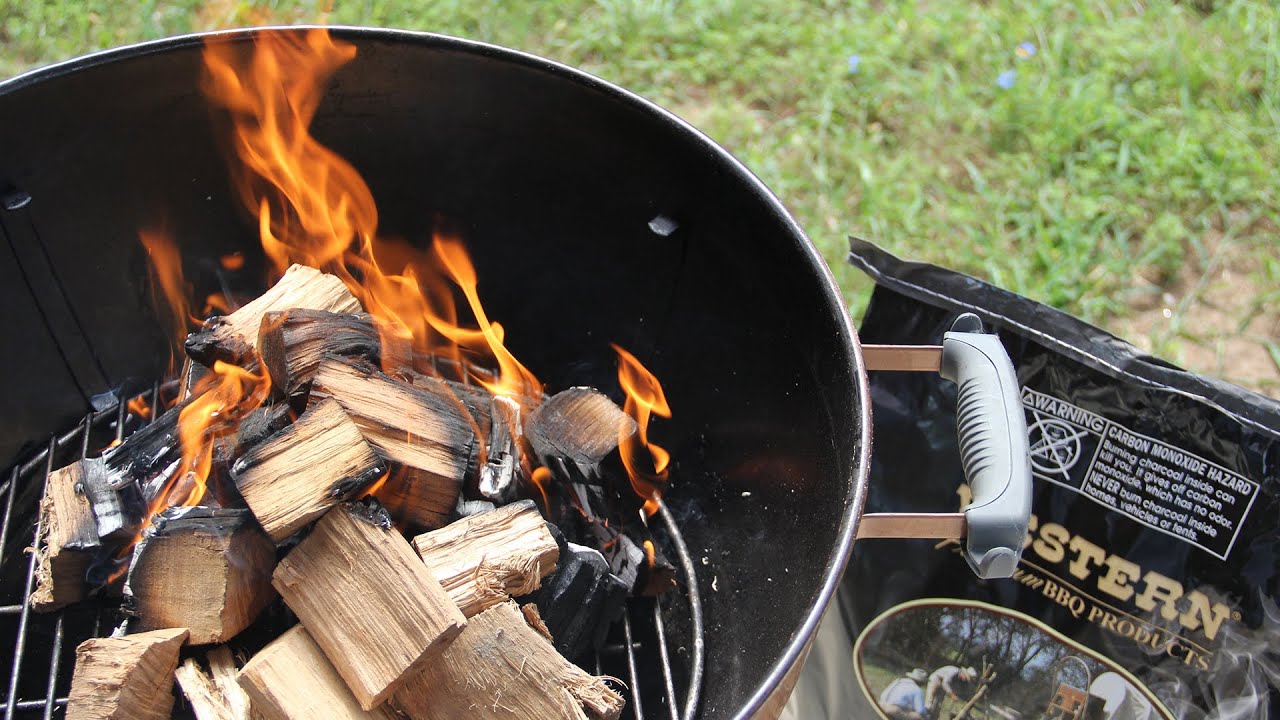 Burning woods in a charcoal BBQ