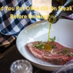 Should you put olive on steak before grilling?